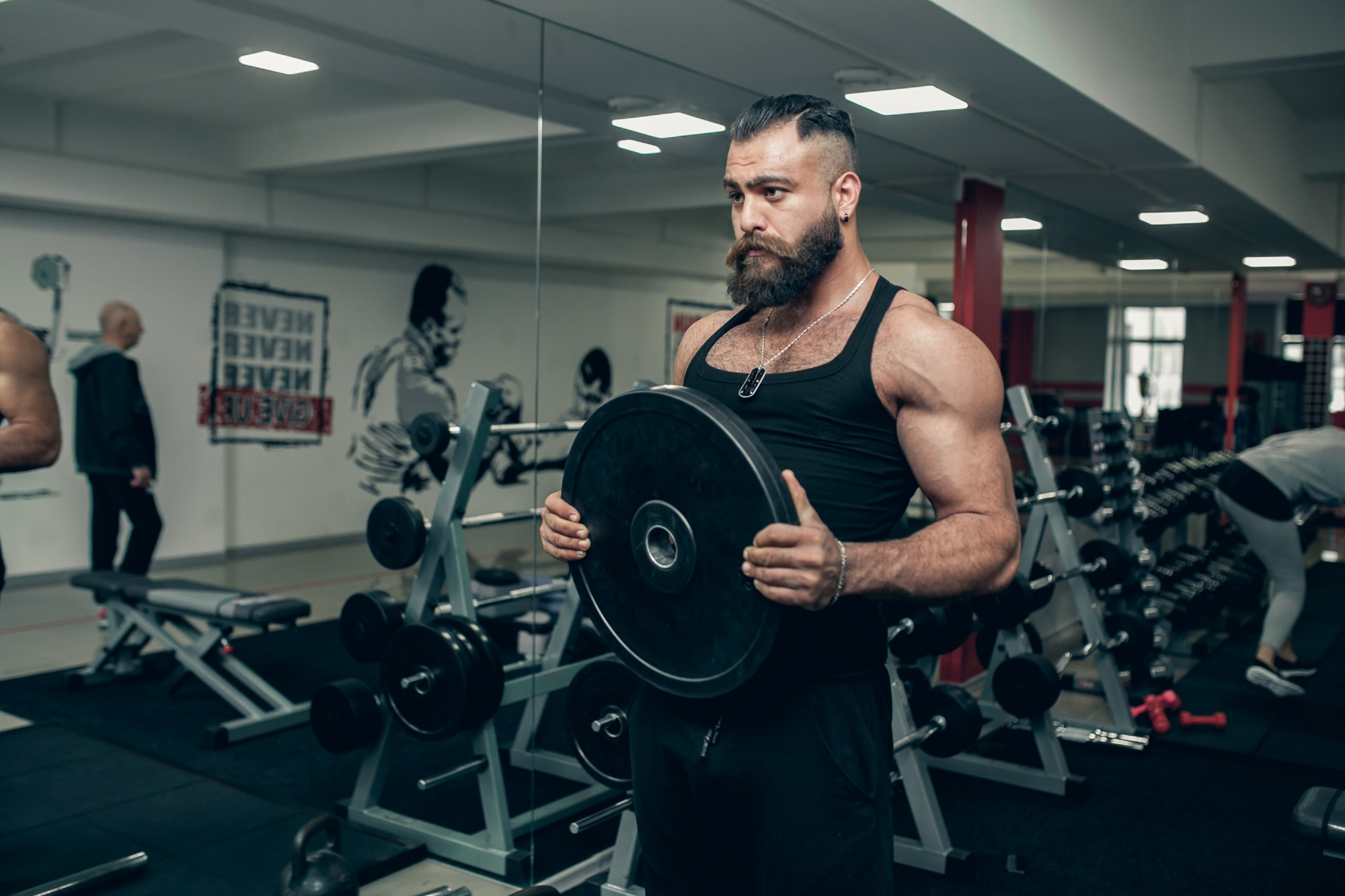 Athlete lifting a dumbbell in a gym